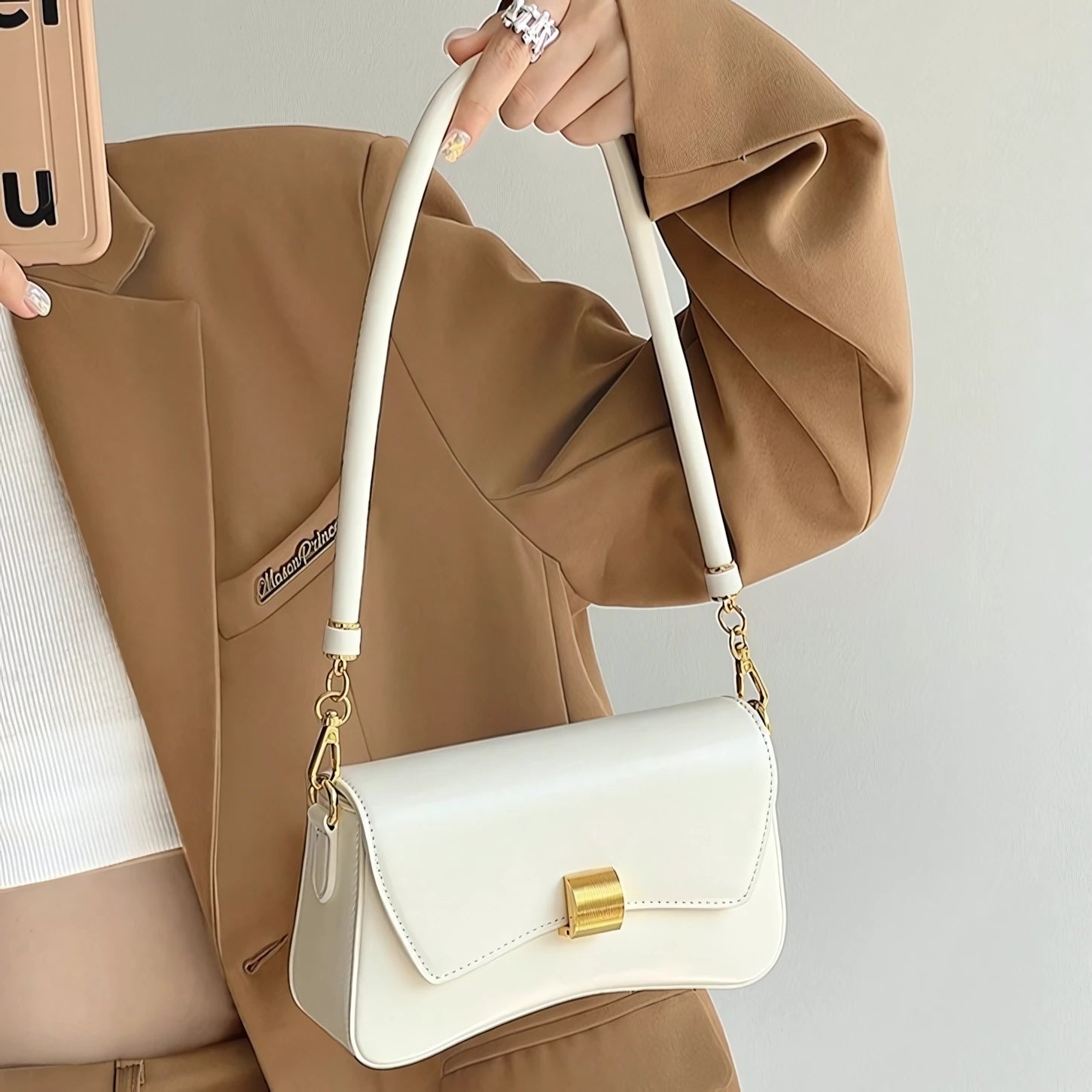 Golden Ripple – Wave-Edge Baguette Bag