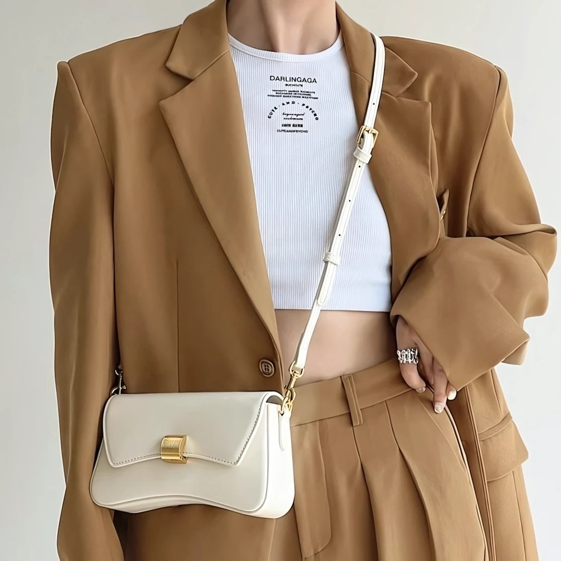 Golden Ripple – Wave-Edge Baguette Bag
